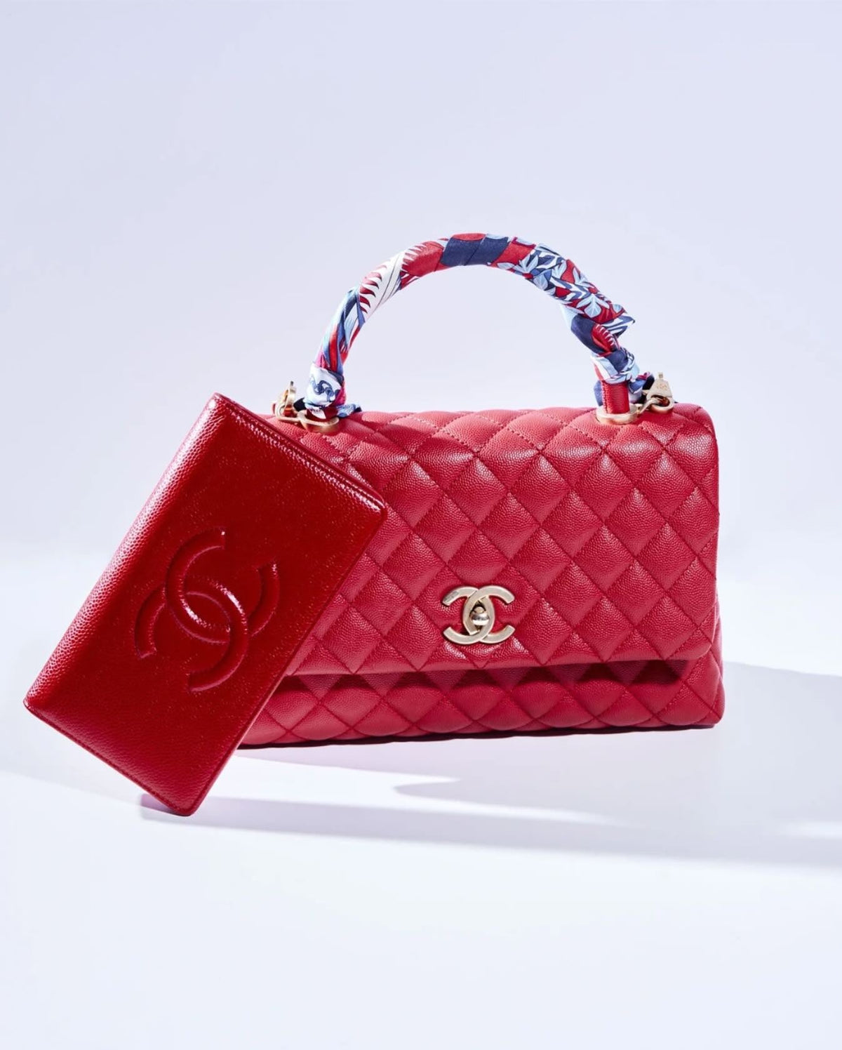 Red quilted leather Chanel handbag with gold hardware and matching red leather Chanel wallet