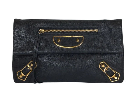 Black Balenciaga City clutch bag with gold hardware and front zipper pocket