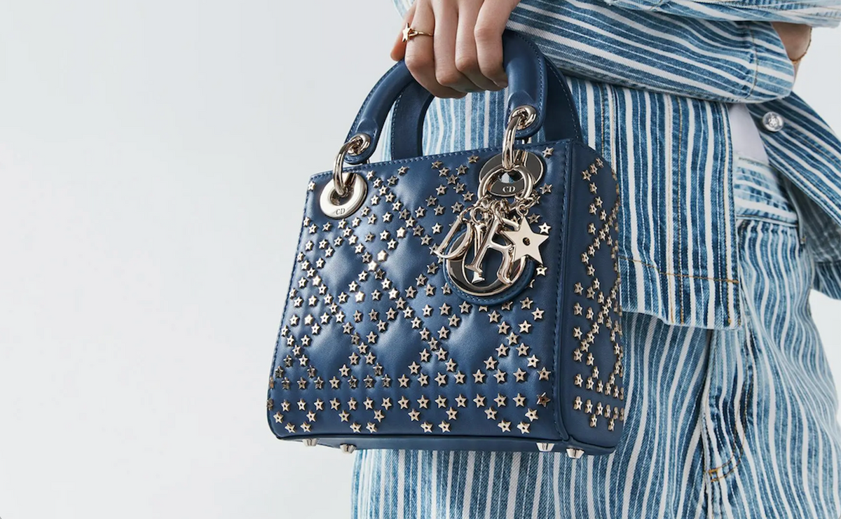 Navy blue Dior Lady Dior handbag with quilted leather and silver star-shaped studs and silver hardware