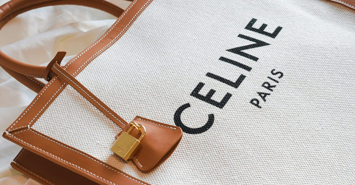 Celine Paris canvas tote bag with brown leather trim and gold hardware lock