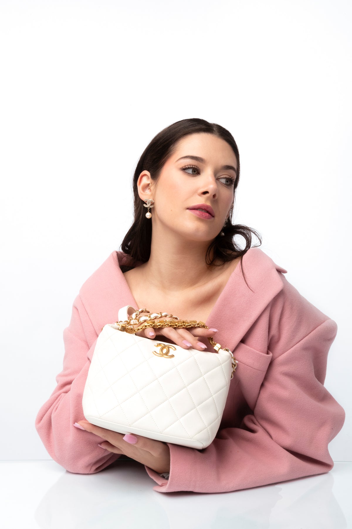 Luxe Du Jour guide book beside a luxury handbag