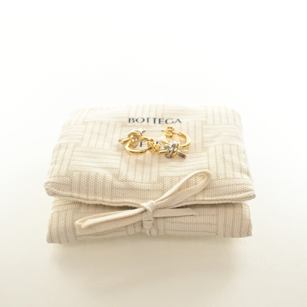 Pre-Owned Bottega Veneta Knot Earrings, shown with dust bag and packaging