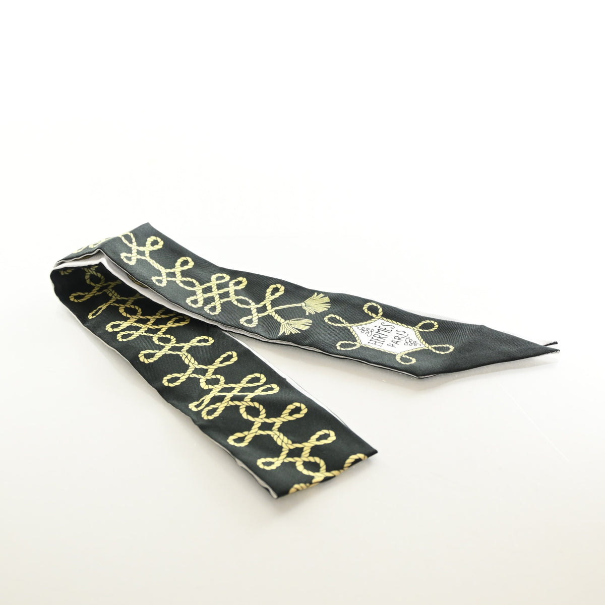Pre-Owned Hermès Galons Et Brandebourg Silk Twilly, flat lay, authenticated at Luxe Du Jour