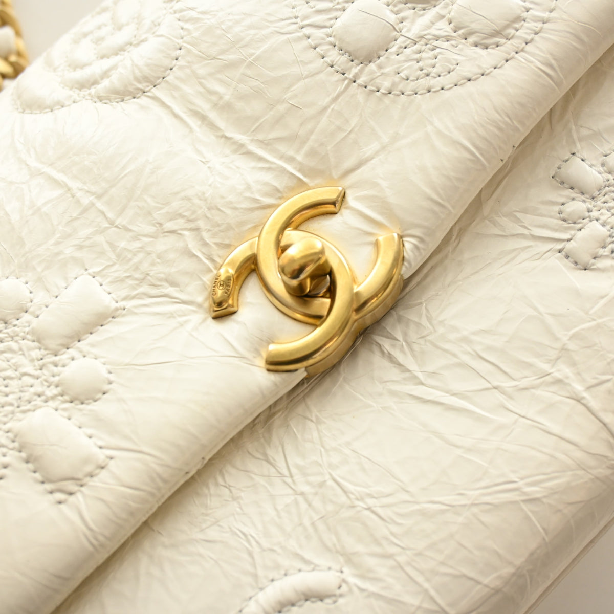 Pre-Owned Chanel Flap Bag Crumpled Calfskin Embossed, gold hardware close-up