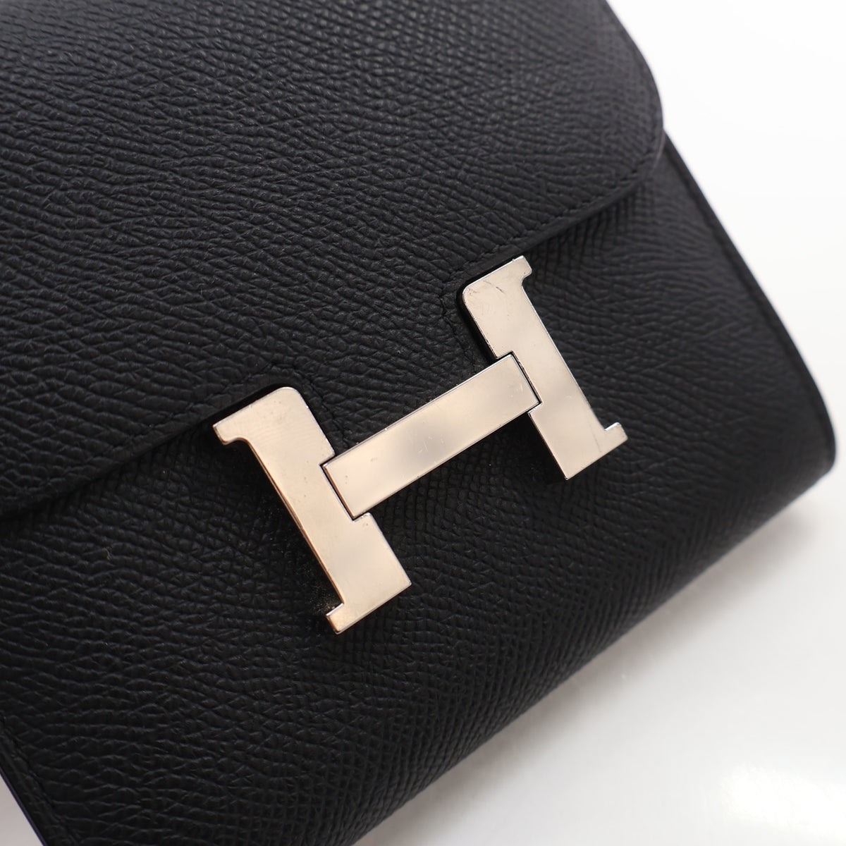 Pre-Owned Hermès Constance Noir Epsom Leather Slim Wallet, gold hardware close-up