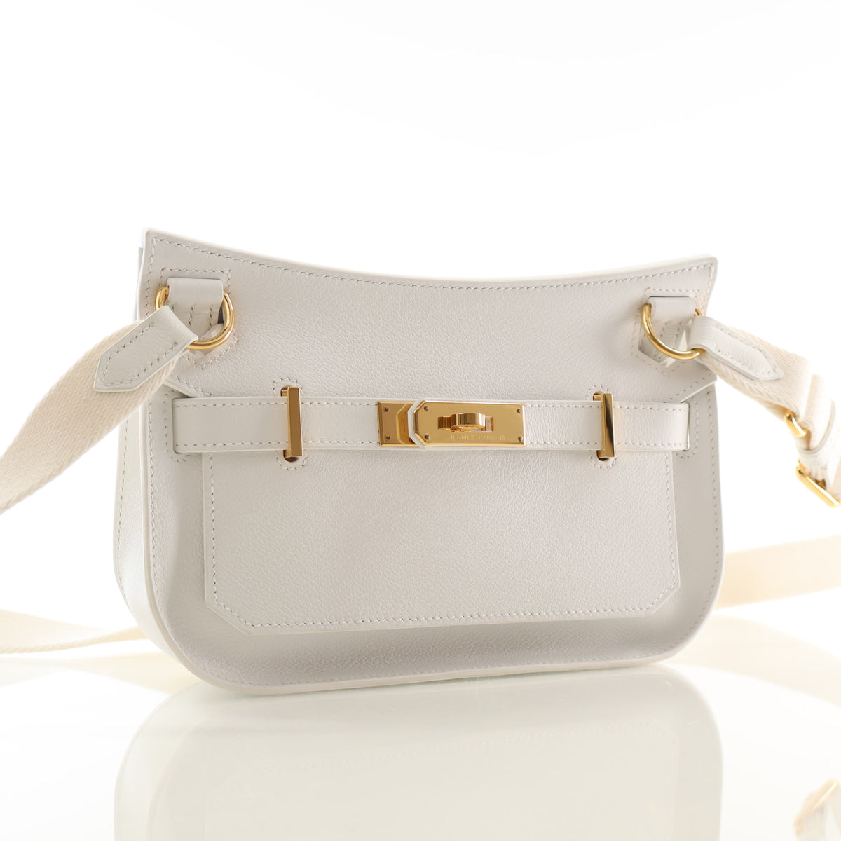 Pre-Owned Hermès Mini Blanc Swift Leather Jypsiere, back view, authenticated at Luxe Du Jour
