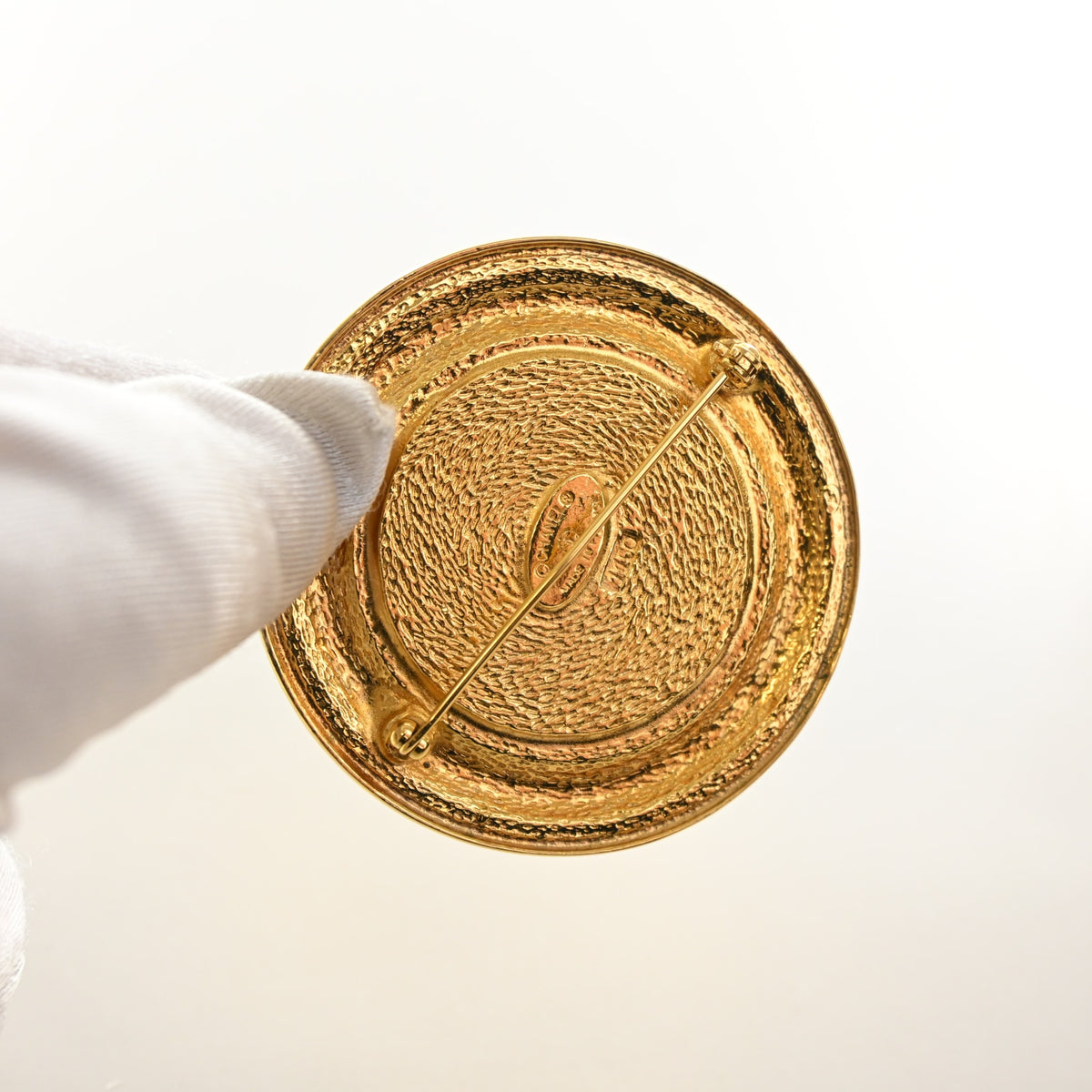 Vintage Chanel Brooch 31 Rue Cambon Medallion, gold hardware close-up, photo 5 of 6