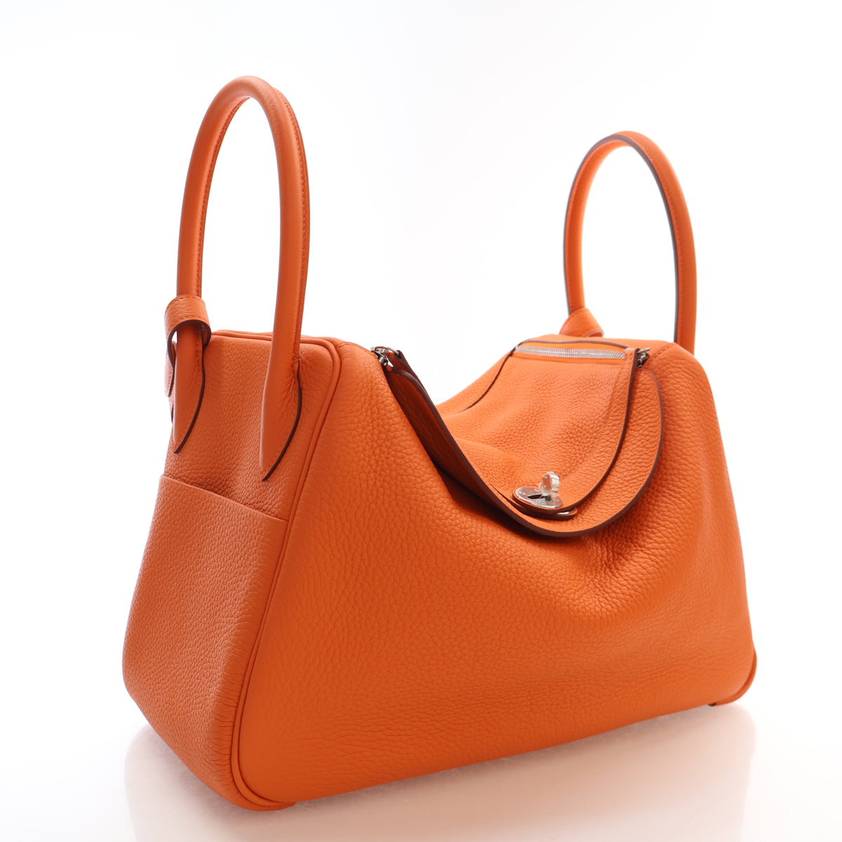 Pre-Owned Hermès Lindy 34 Orange H Clemence Leather, three-quarter view, authenticated at Luxe Du Jour
