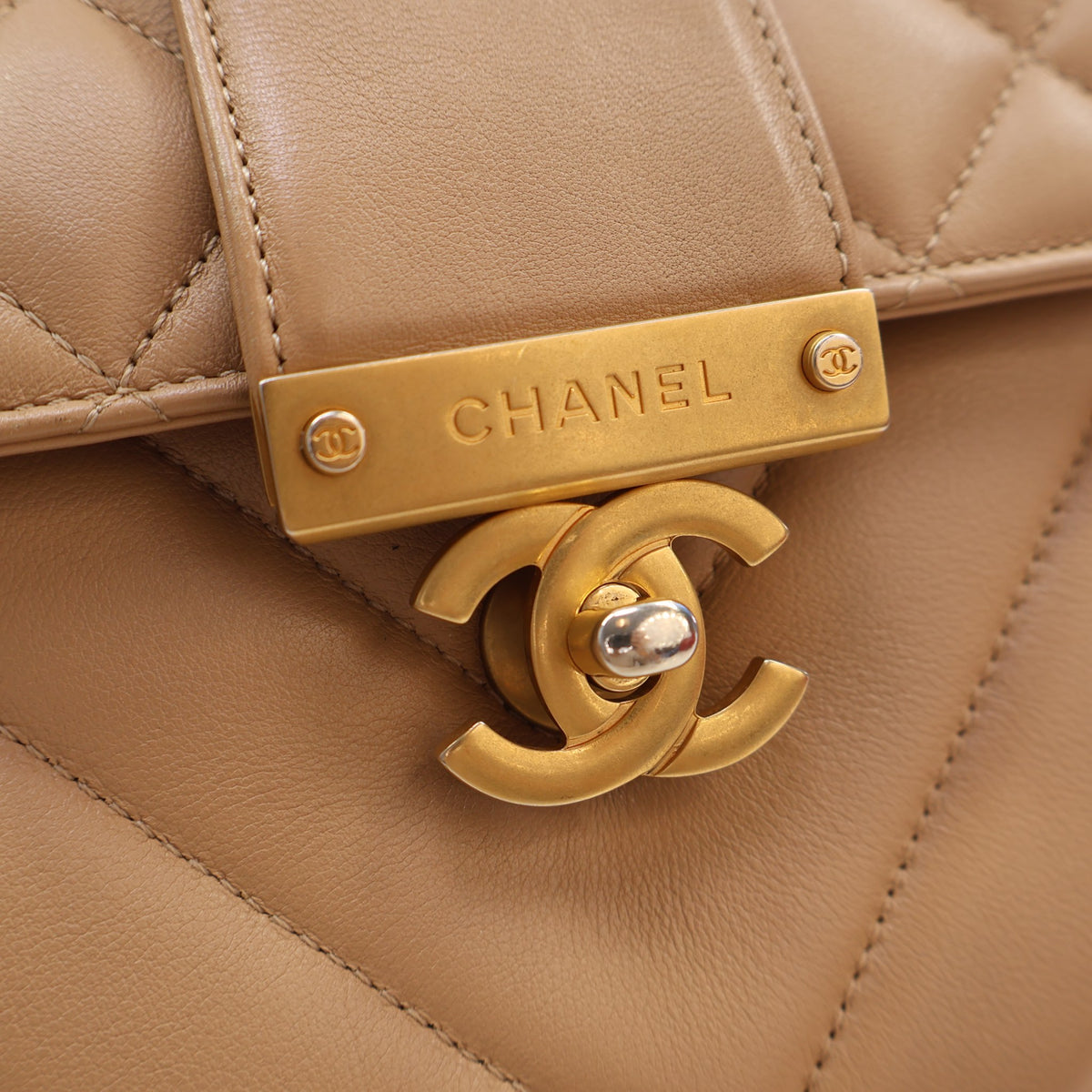 Pre-Owned Chanel Calfskin Chevron In The City Bag, gold hardware close-up