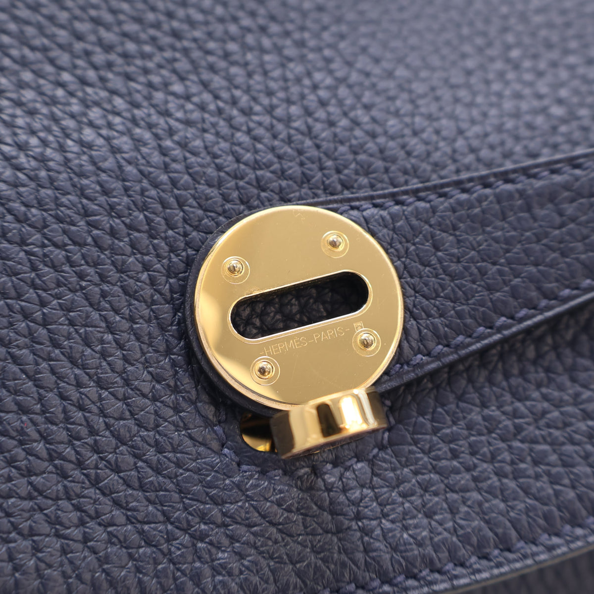 Pre-Owned Hermès Lindy 30 Bleu Nuit Clemence Leather, gold hardware close-up