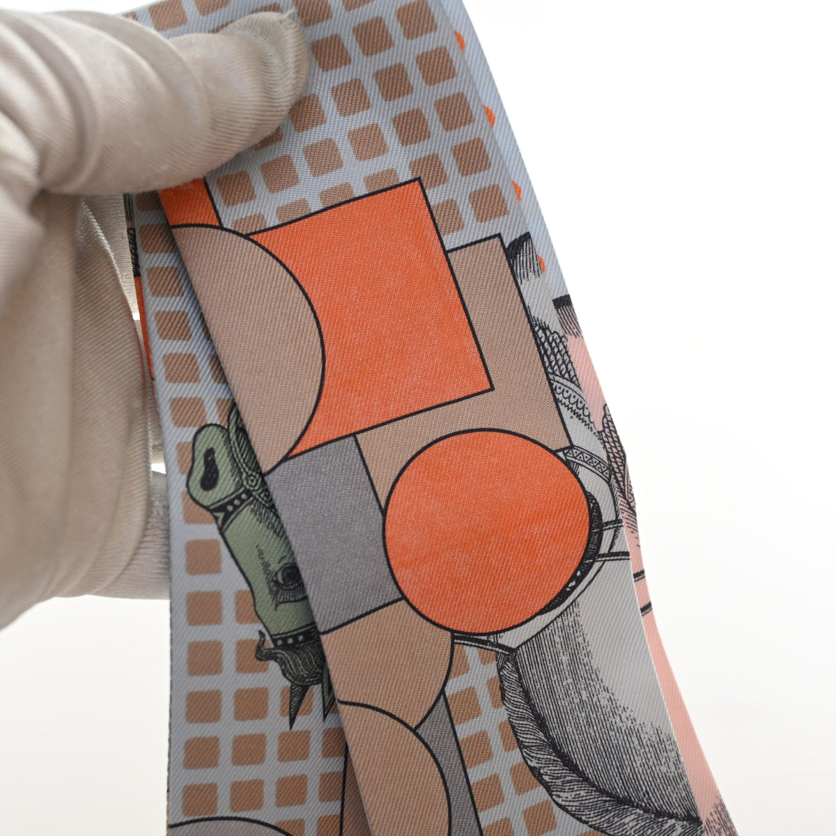Pre-Owned Hermès Cavalier En Formes Silk Twilly, held in hand, authenticated at Luxe Du Jour
