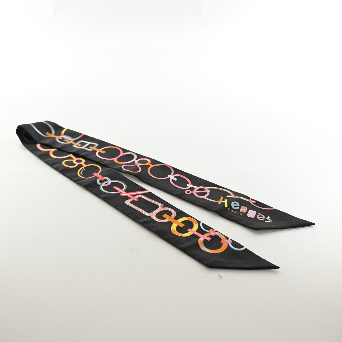 Pre-Owned Hermès Do Re Boucles Silk Twilly, flat lay, authenticated at Luxe Du Jour
