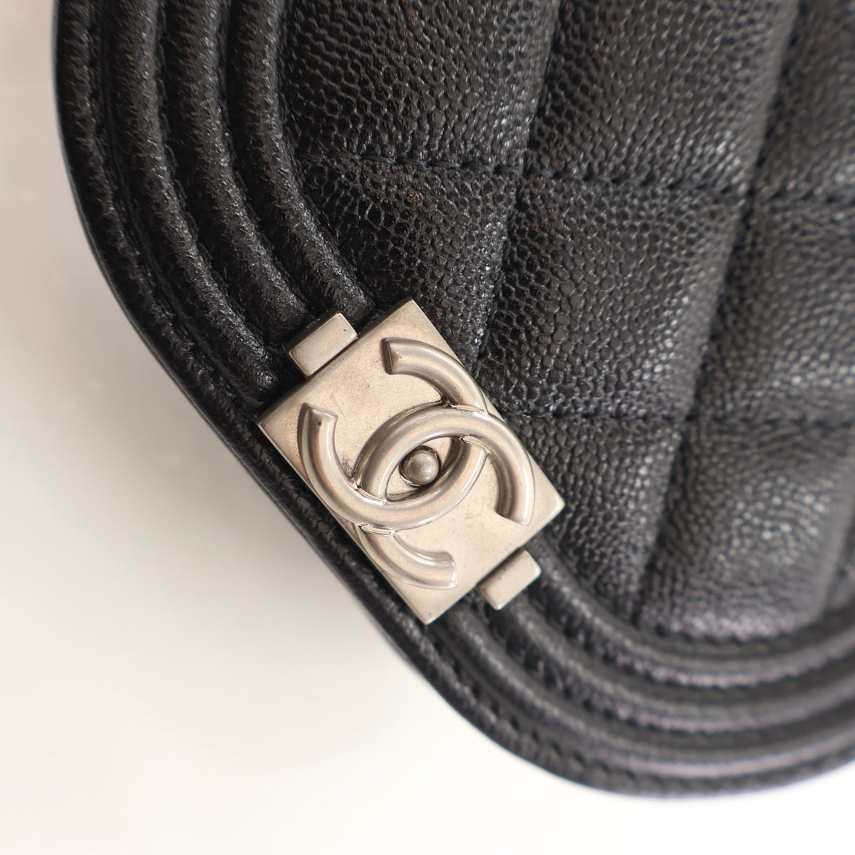 Pre-Owned Chanel Mini Calfskin Boy Messenger, silver hardware close-up