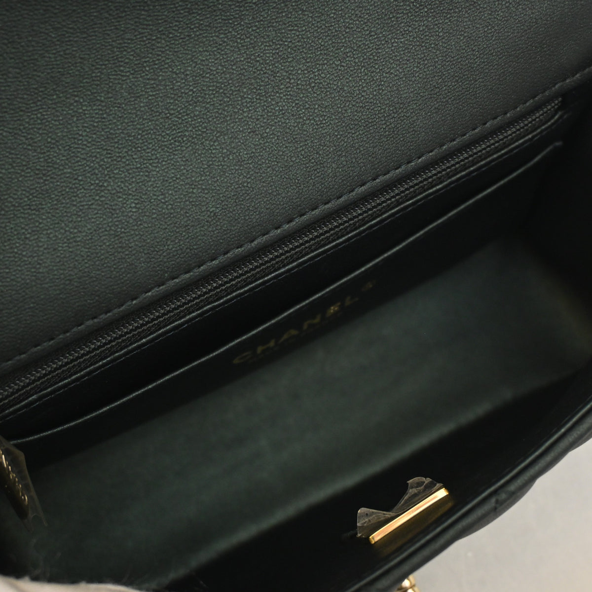 Pre-Owned Chanel Classic Flap Mini Calfskin Rectangular Top Handle Bag, open interior with lining