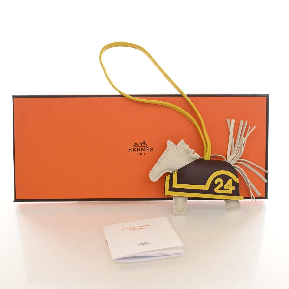 Pre-Owned Hermès Charm 24 Milo Lambskin Rodeo Robeo PM, shown with dust bag and packaging