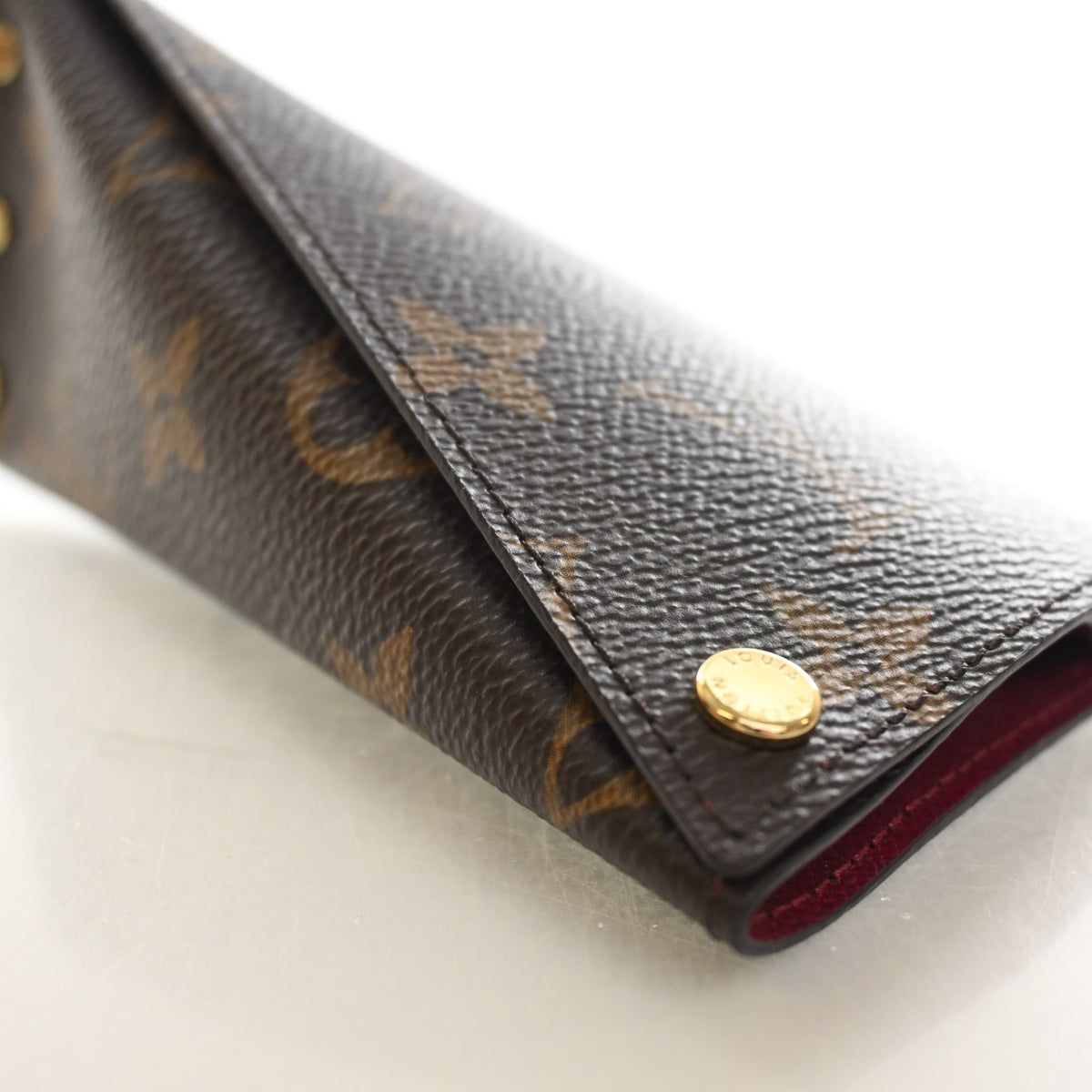 Pre-Owned Louis Vuitton Monogram Berlingo Key Pouch, gold hardware close-up