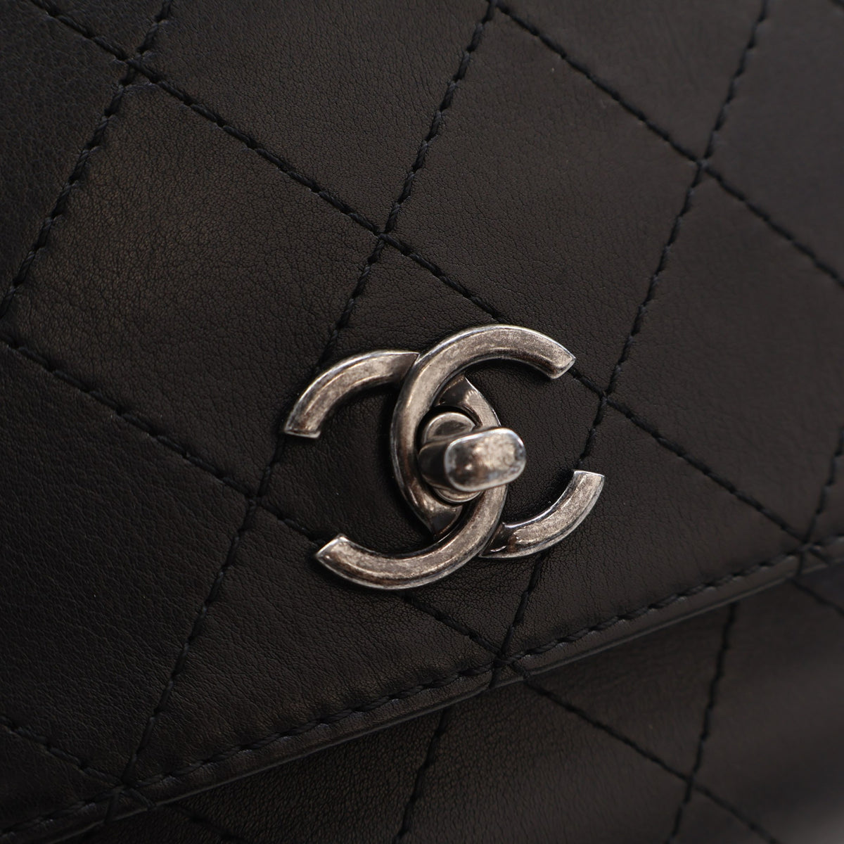 Pre-Owned Chanel Flap Bag Medium Calfskin Urban Luxury, silver embossed logo detail