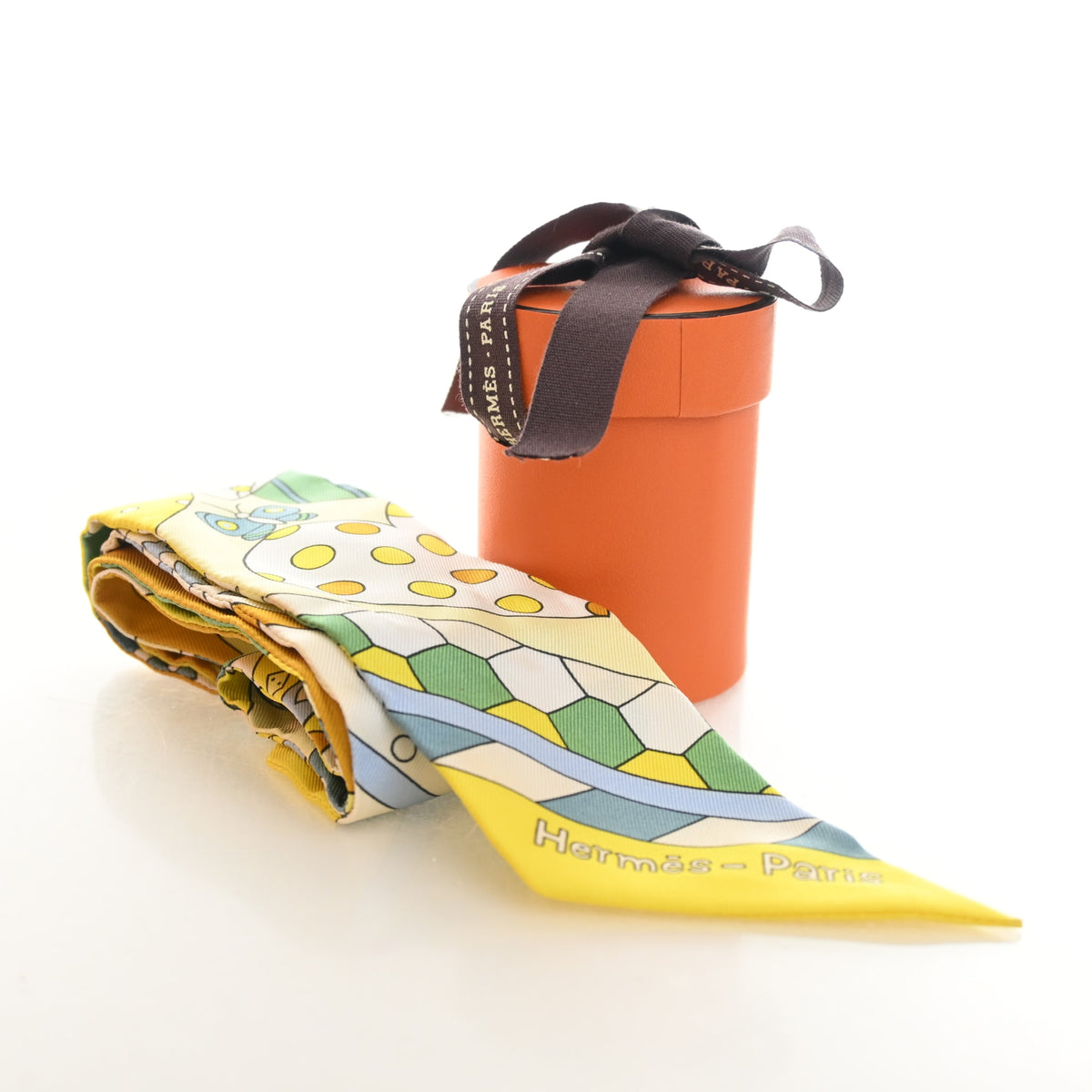Pre-Owned Hermès Les Murmures De La Foret Silk Twilly, shown with dust bag and packaging
