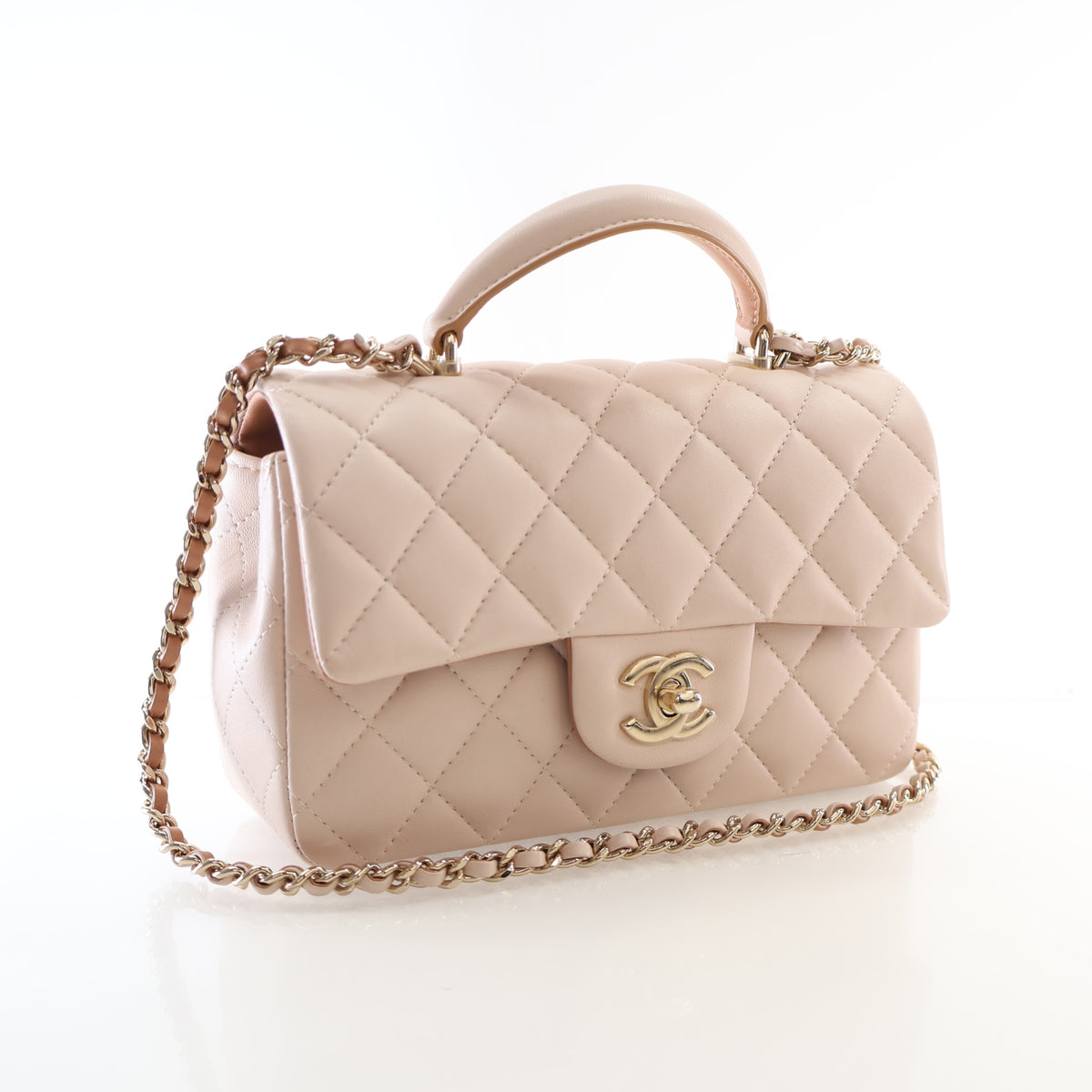 Pre-Owned Chanel Top Handle Mini Lambskin Rectangular Flap Bag, three-quarter view, authenticated at Luxe Du Jour