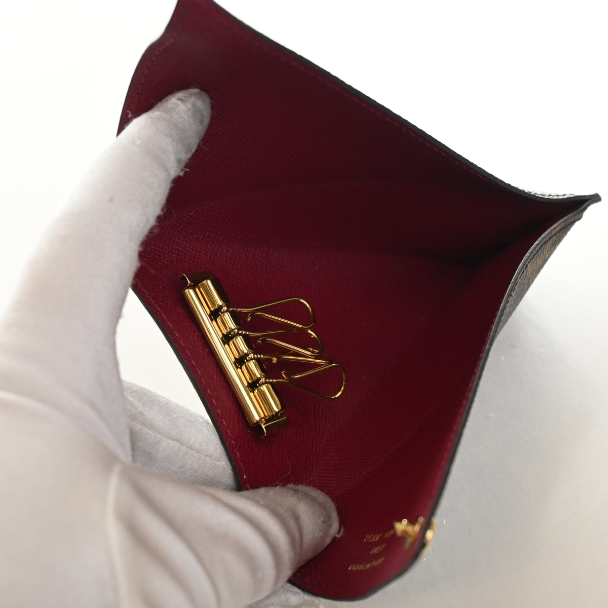 Pre-Owned Louis Vuitton Monogram Berlingo Key Pouch, open interior with lining