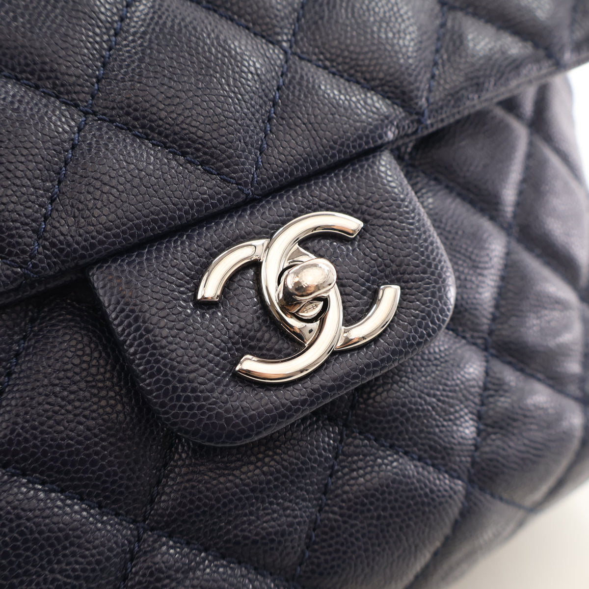 Pre-Owned Chanel Flap Bag Medium Caviar Leather Urban Companion, silver hardware close-up