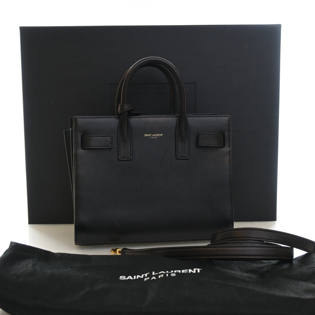 Pre-Owned Saint Laurent Sac De Jour Nano Box Calf, shown with dust bag and packaging