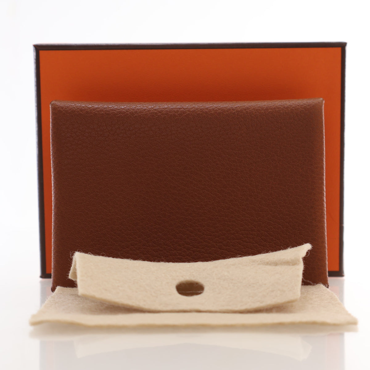 Pre-Owned Hermès Card Holder Fauve Barenia Leather Calvi Duo, shown with dust bag and packaging