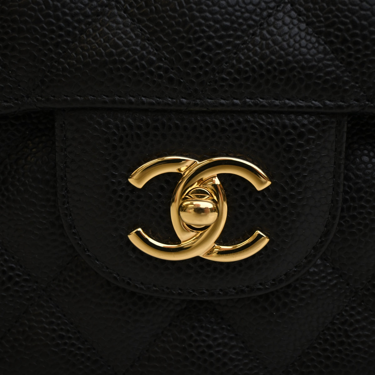 Pre-Owned Chanel Classic Double Flap Jumbo Caviar Leather Bag, gold hardware close-up, photo 4 of 14