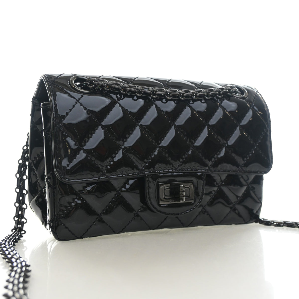 Pre-Owned Chanel Flap Bag 224 Patent Leather Reissue 2.55, three-quarter view, authenticated at Luxe Du Jour