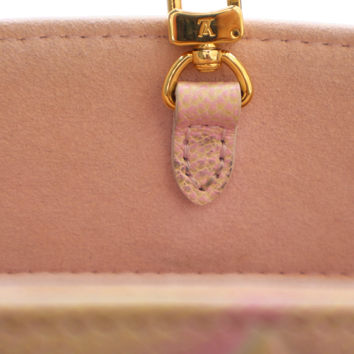 Pre-Owned Louis Vuitton Onthego PM Stardust Monogram, gold hardware close-up