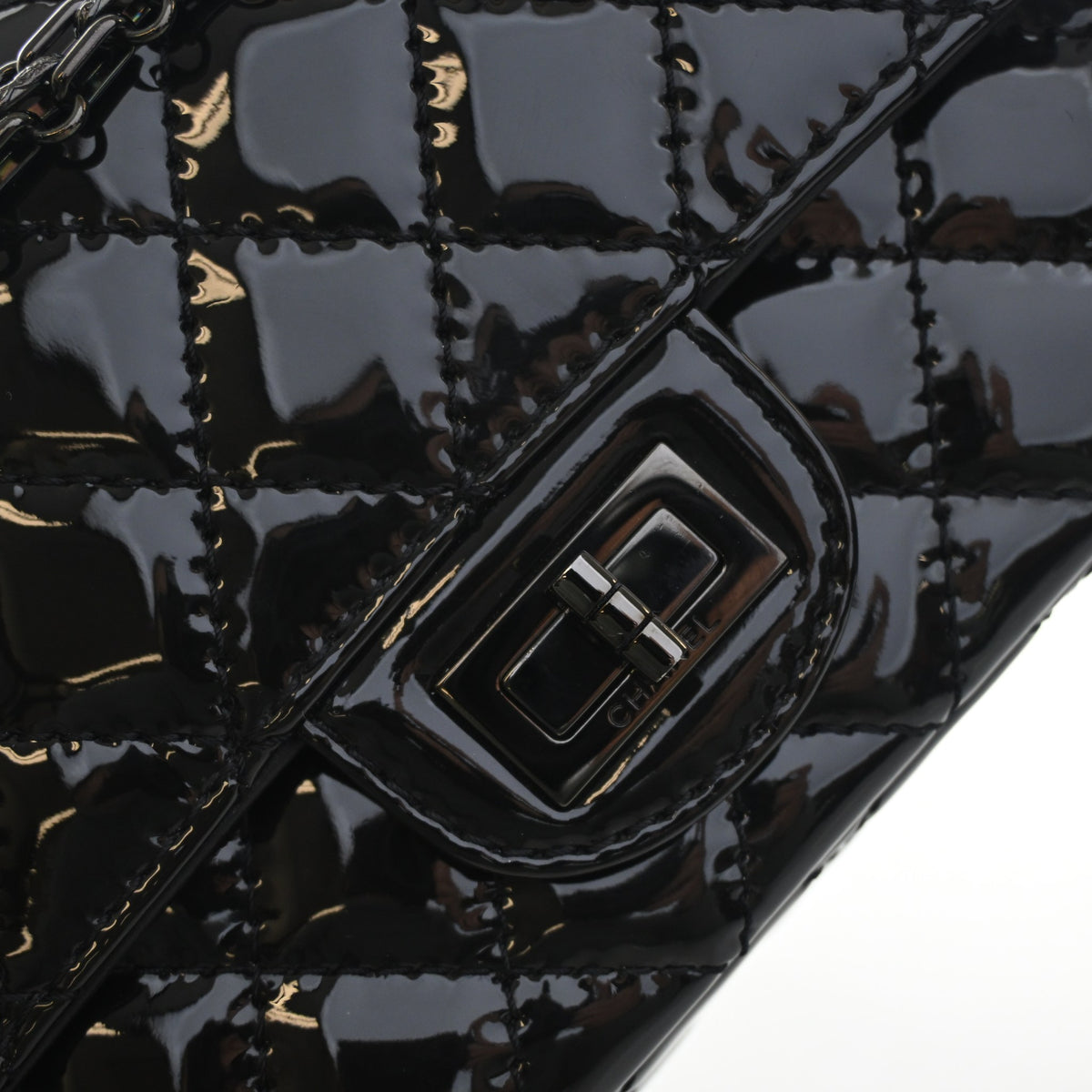 Pre-Owned Chanel Flap Bag 224 Patent Leather Reissue 2.55, silver hardware close-up