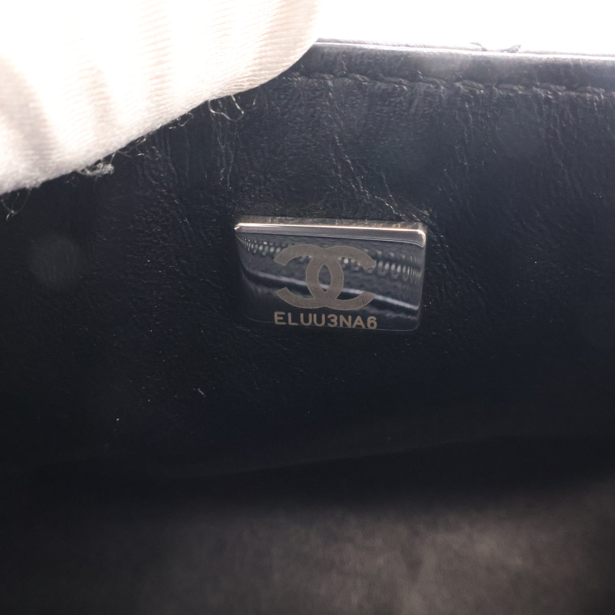 Pre-Owned Chanel Flap Bag Mini Aged Calfskin Reissue 2.55, silver embossed logo detail