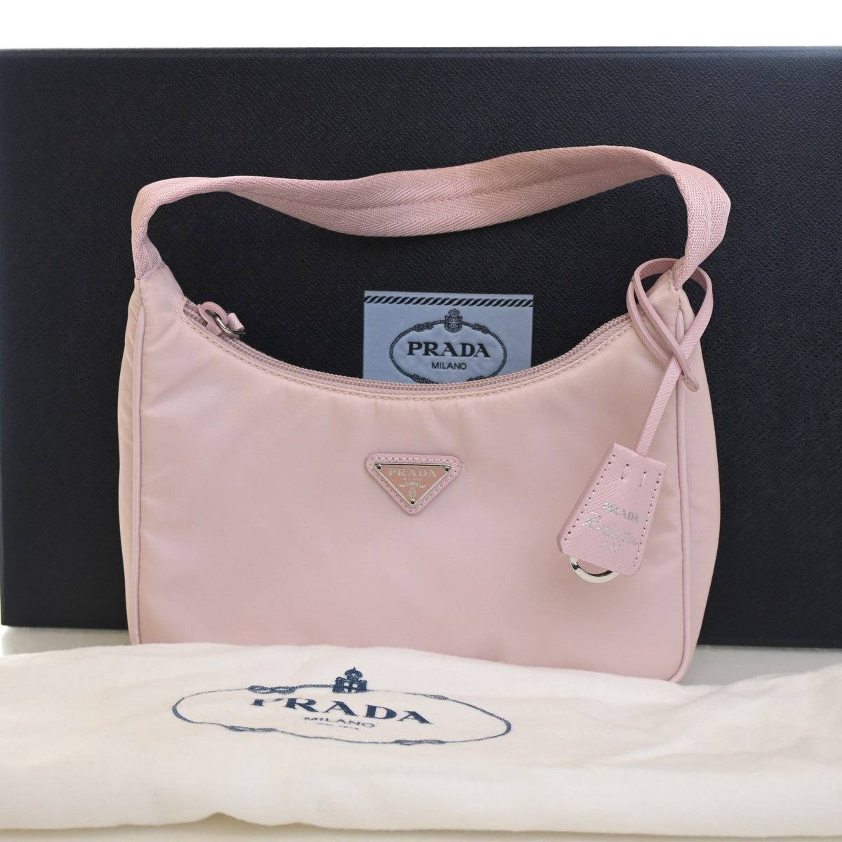 Pre-Owned Prada Re-nylon Re-edition 2000, shown with dust bag and packaging