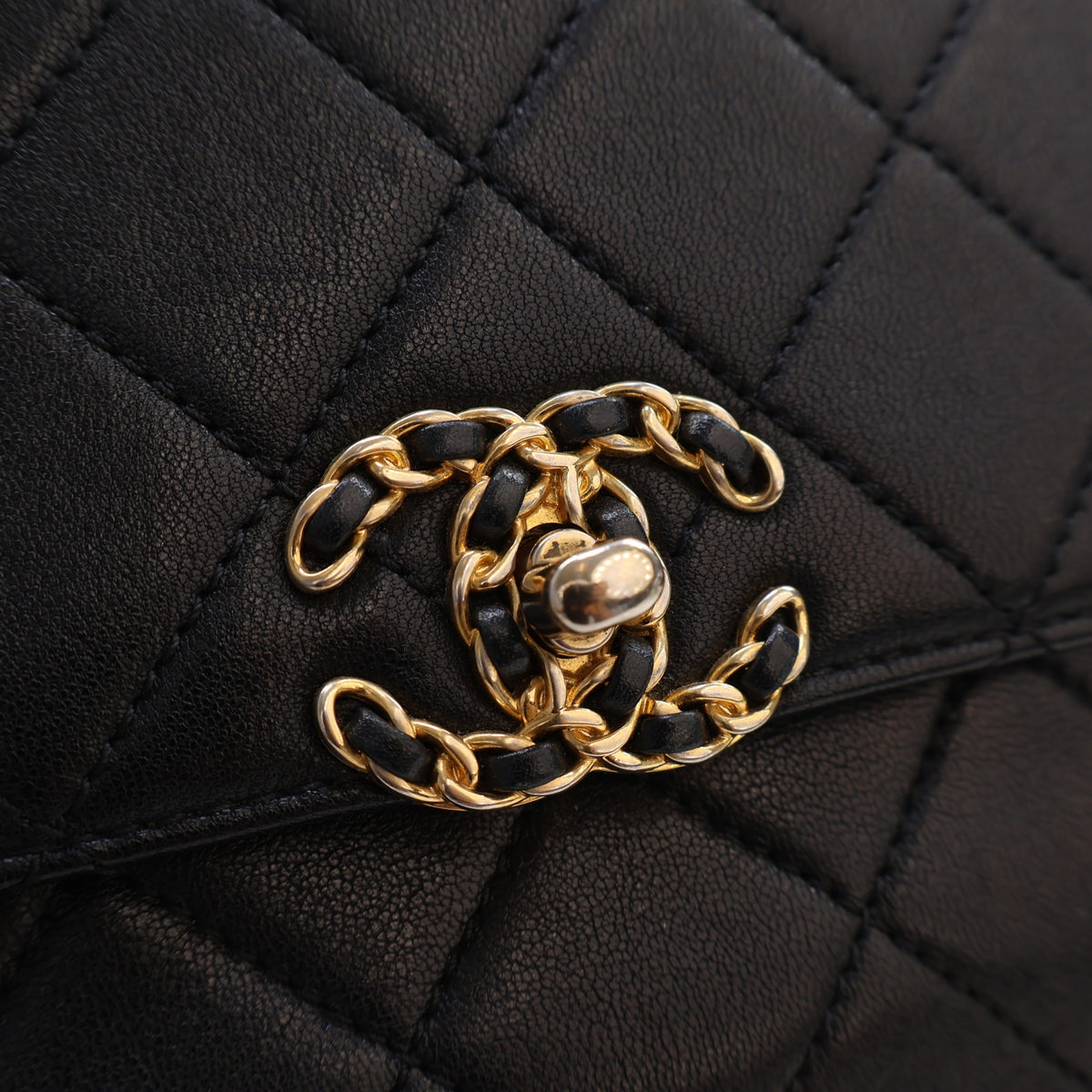 Pre-Owned Chanel Top Handle Medium Calfskin Quilted Chain Infinity Flap, gold hardware close-up