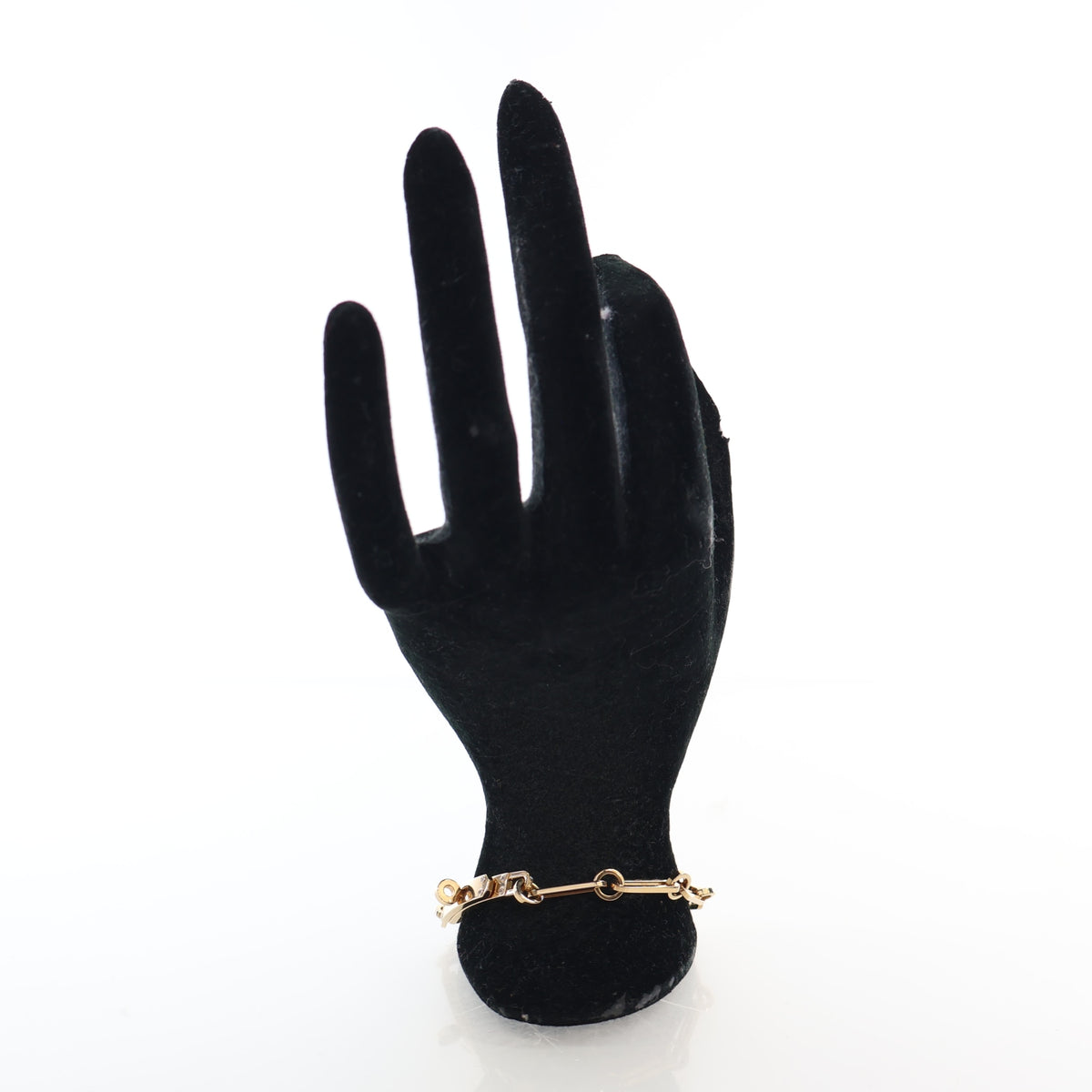 Pre-Owned Hermès Kelly Small 18k Yellow Gold Diamond Chaine Bracelet, held in hand