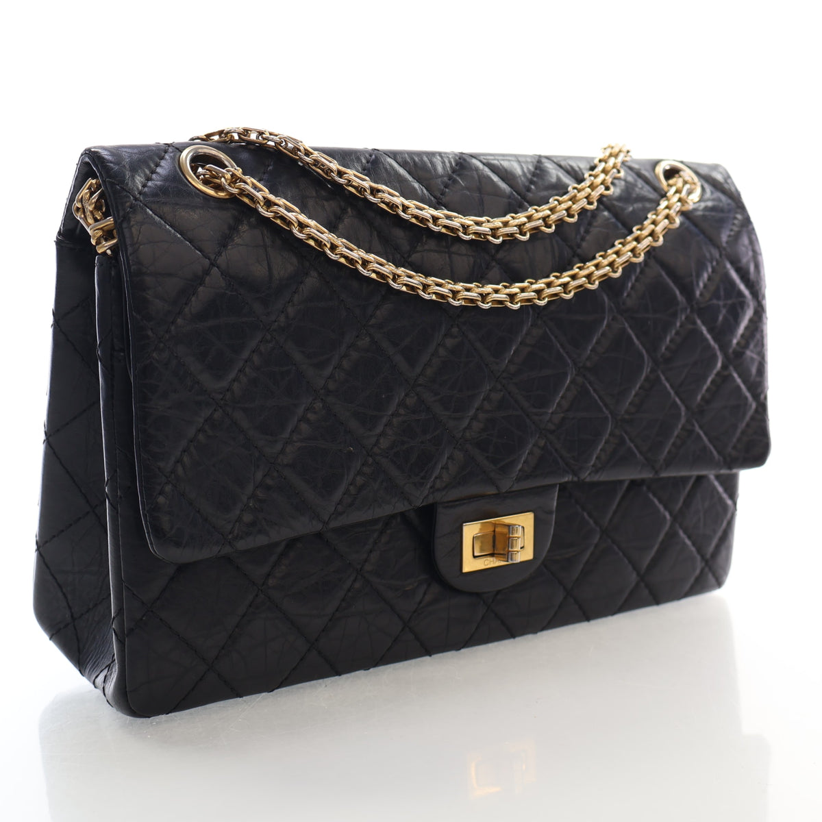 Pre-Owned Chanel Flap Bag Aged Calfskin 2.55 Reissue, three-quarter view, authenticated at Luxe Du Jour