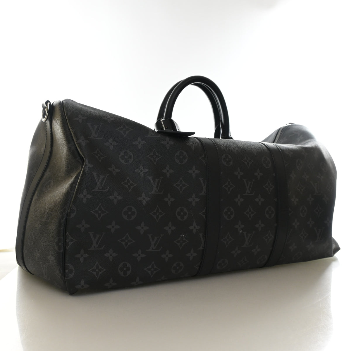 Pre-Owned Louis Vuitton 55 Monogram Eclipse Keepall, three-quarter view, authenticated at Luxe Du Jour