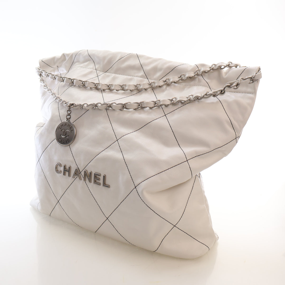 Pre-Owned Chanel 22 Hobo Medium Shiny Calfskin, held in hand