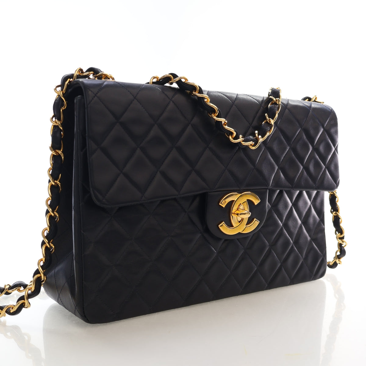 Vintage Chanel Flap Bag Maxi Lambskin Classic Single, three-quarter view, authenticated at Luxe Du Jour