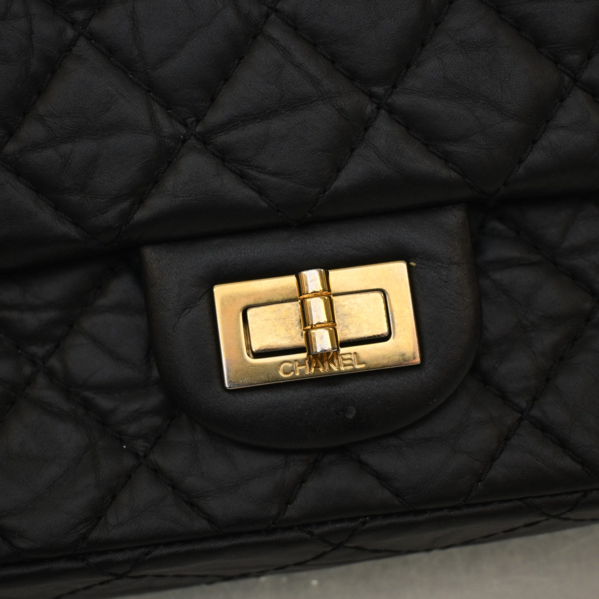 Pre-Owned Chanel Flap Bag 225 Aged Calfskin Reissue 2.55, gold hardware close-up