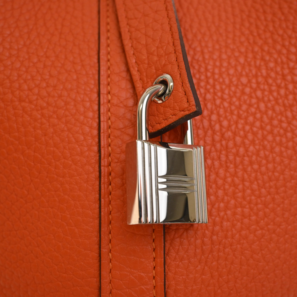 Pre-Owned Hermès Picotin Lock 26 Orange Clemence Leather, silver hardware close-up