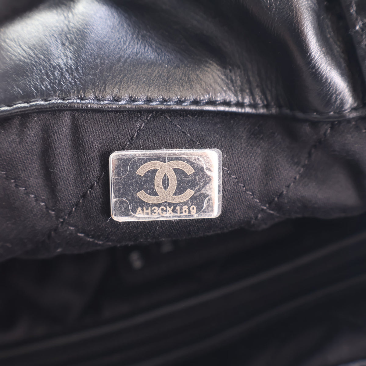 Pre-Owned Chanel Backpack 22 Shiny Calfskin, silver embossed logo detail, photo 16 of 17