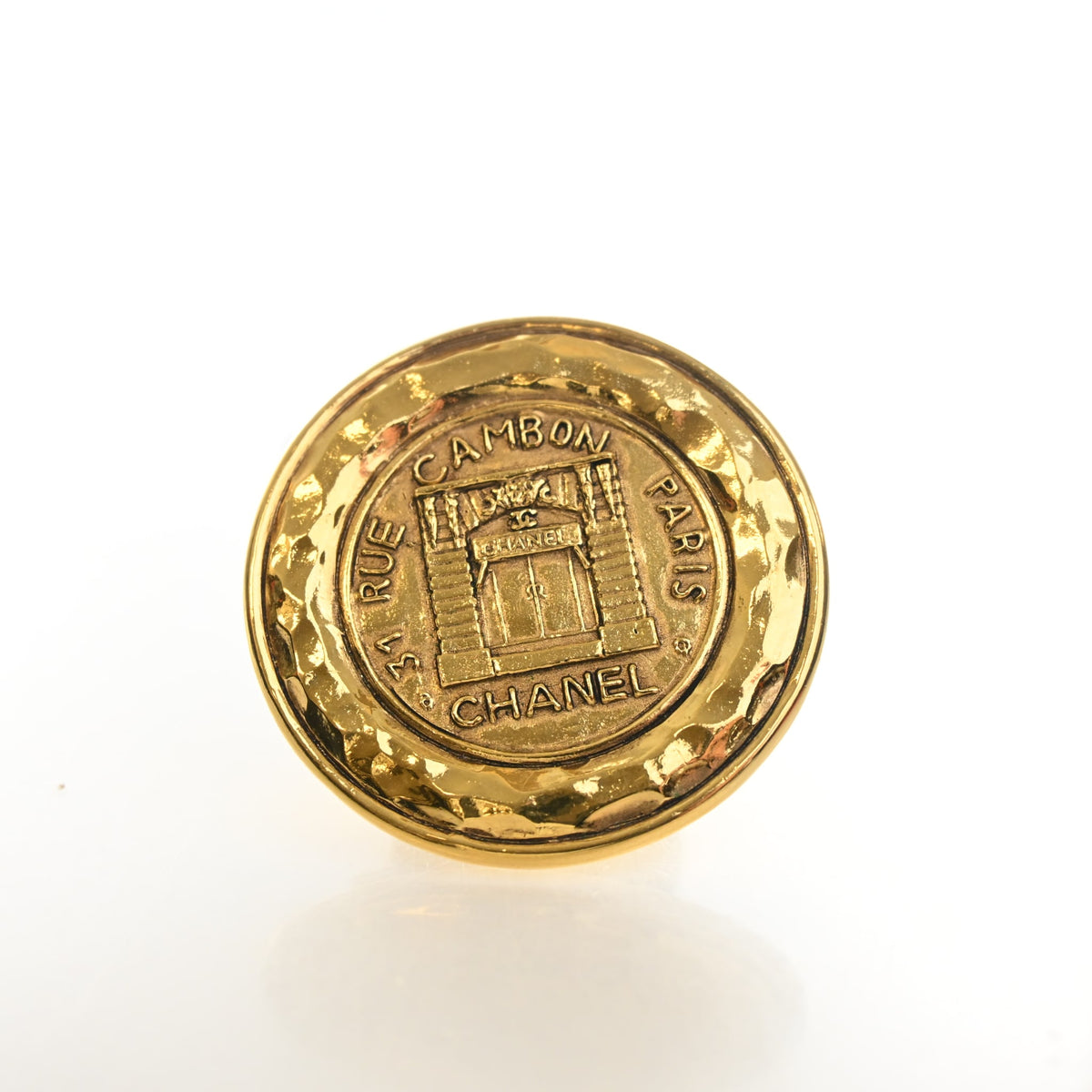 Vintage Chanel Brooch 31 Rue Cambon Medallion, gold hardware close-up, authenticated at Luxe Du Jour