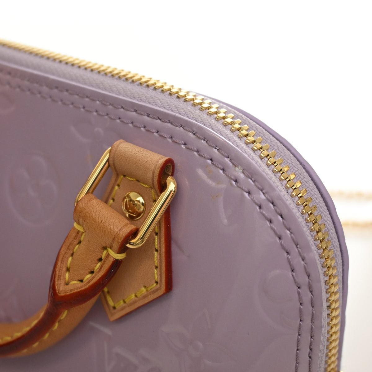 Pre-Owned Louis Vuitton Alma Nano Monogram Vernis, gold hardware close-up