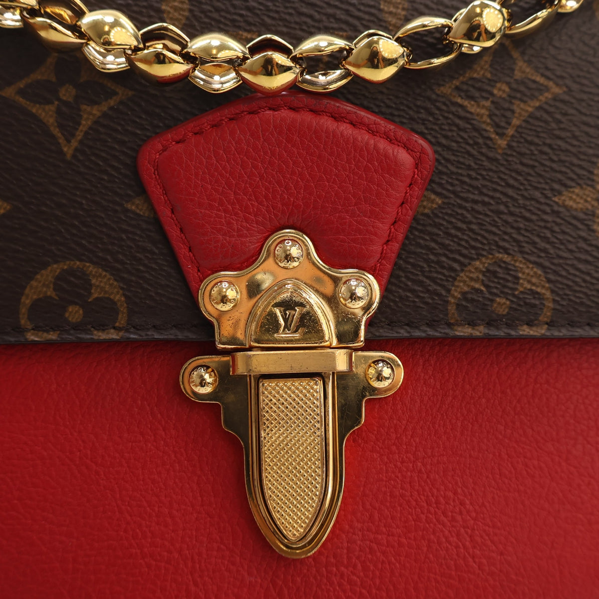 Pre-Owned Louis Vuitton Coated Canvas Monogram Victoire Handbag, gold hardware close-up