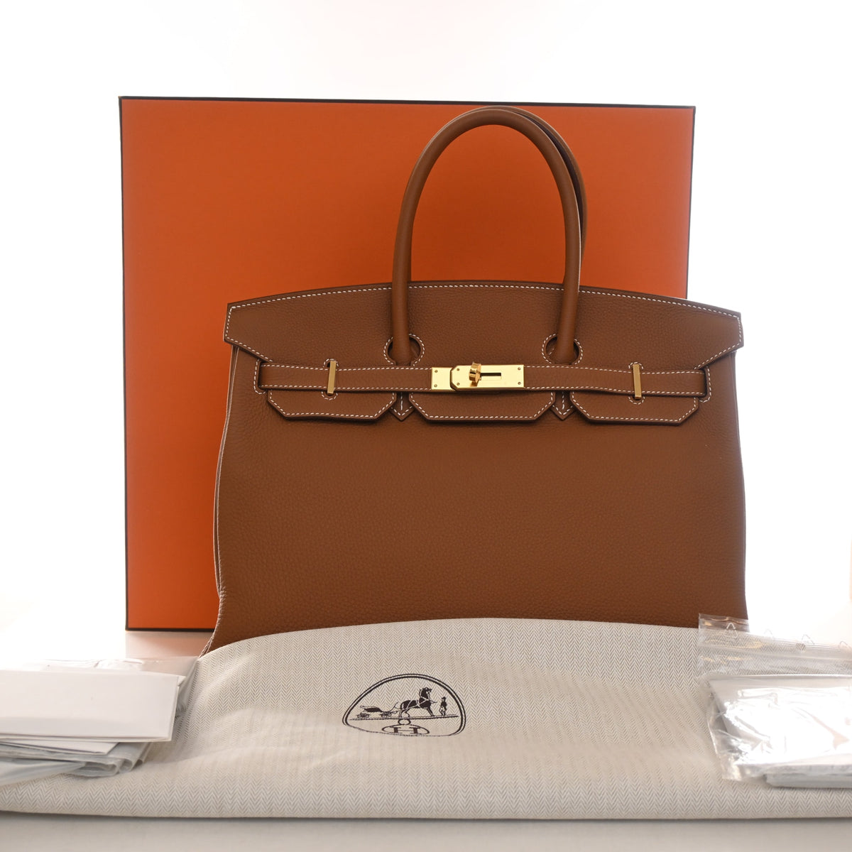 Pre-Owned Hermès Birkin 35 Gold Togo Leather, shown with dust bag and packaging