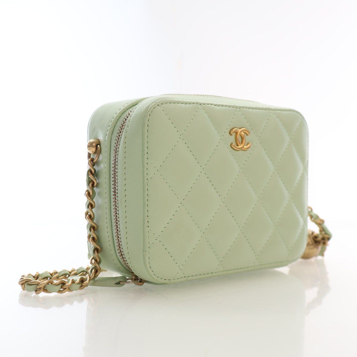 Pre-Owned Chanel Case Mini Lambskin Pearl Crush Camera Bag, three-quarter view, authenticated at Luxe Du Jour