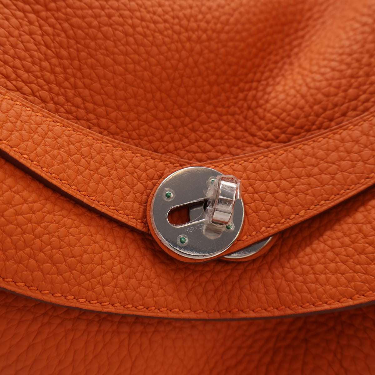 Pre-Owned Hermès Lindy 34 Orange H Clemence Leather, silver hardware close-up