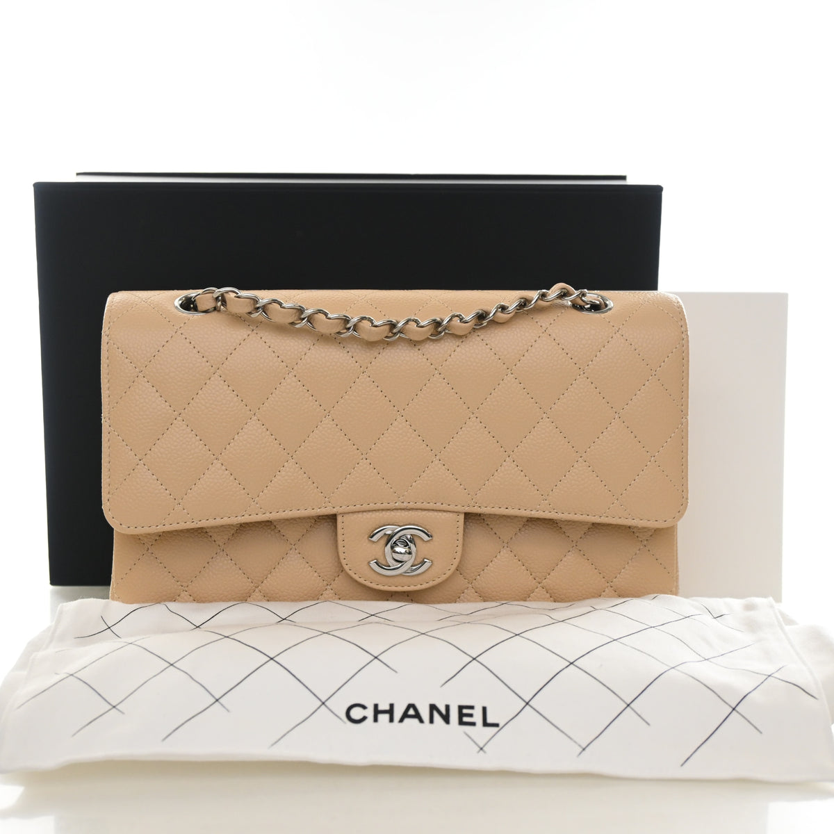 Pre-Owned Chanel Classic Flap Medium Caviar Leather Bag, shown with dust bag and packaging