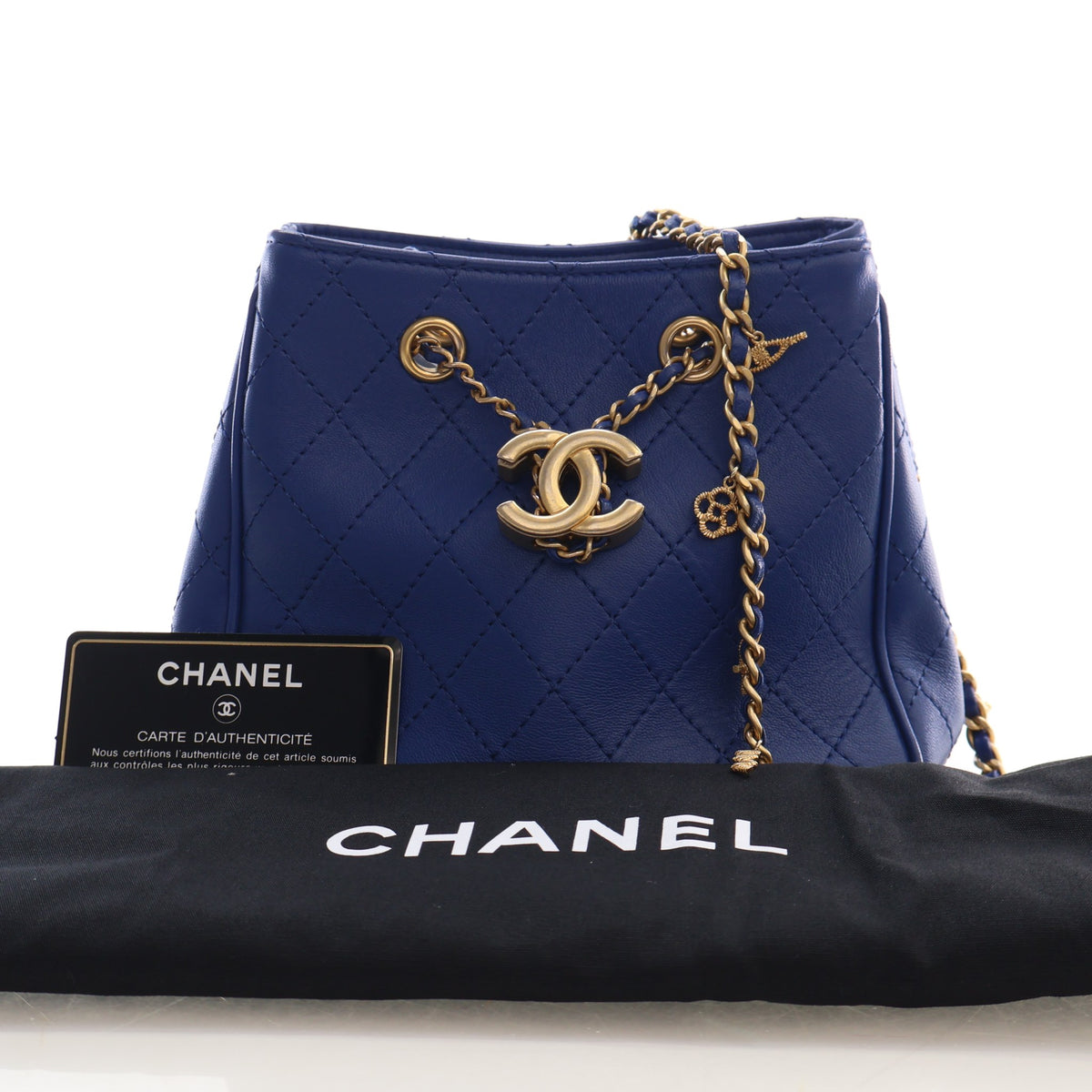 Pre-Owned Chanel Bucket Bag Mini Calfskin Egyptian Amulet Drawstring, shown with dust bag and packaging